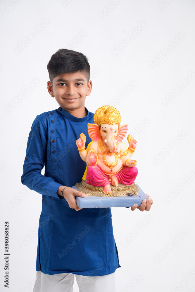 Indian little boy with lord ganesha , Celebrating Ganesh Festival Indian little boy with lord ganesha , Celebrating Ganesh Festival