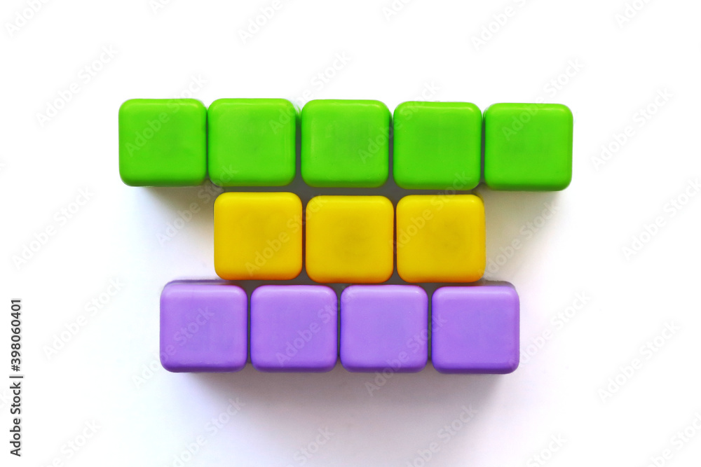 Coloured cubes. Template of three rows of five, three and four letter words. Coloured cubes. Template of three rows of five, three and four letter words.
