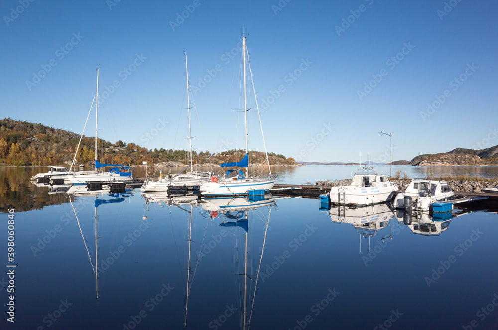 Fototapeta premium Norwegian landscape with small boats and yachts