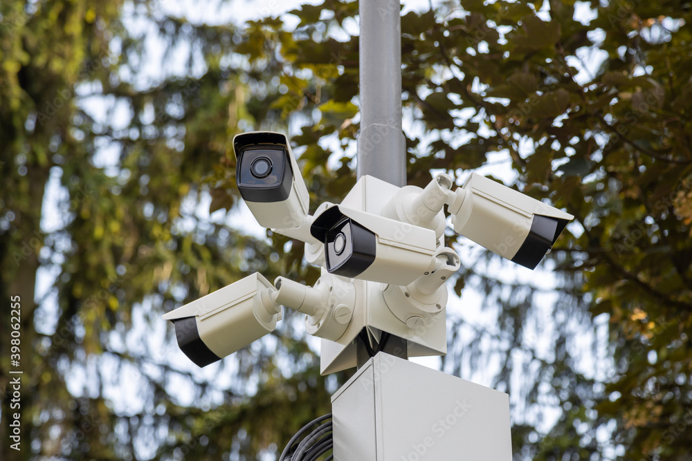 Lamp post with lots of CCTV cameras. Surveillance and modern city security concept. Lamp post with lots of CCTV cameras. Surveillance and modern city security concept.