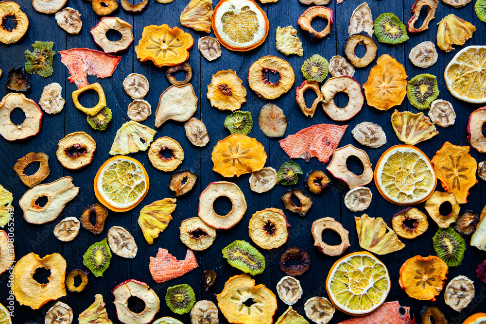 Organic Healthy Assorted Dried Fruit Mix close up. Dried fruit snacks. dried apples, mango, feijoa, dried apricots, prunes top view Organic Healthy Assorted Dried Fruit Mix close up. Dried fruit snacks. dried apples, mango, feijoa, dried apricots, prunes top view