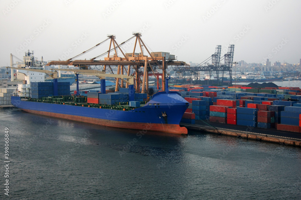Fototapeta premium Cargo ships in Port of Alexandria, is considered the second most important city and the main port in Egypt, it handles over three quarters of Egypt’s foreign trade.