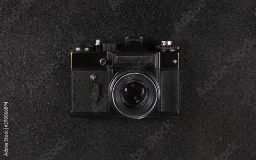 old vintage black camera on black background