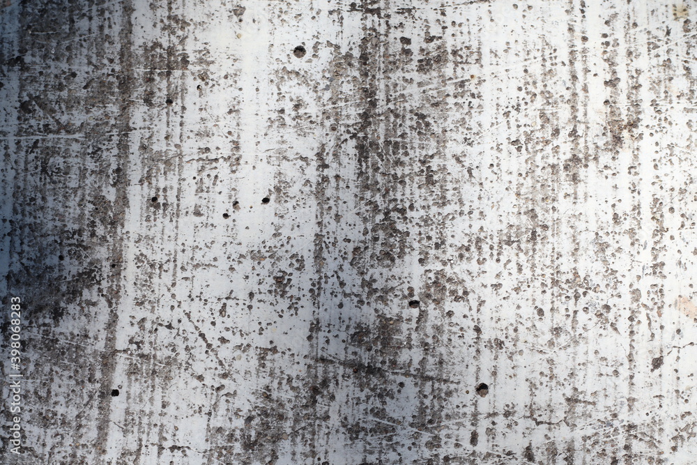 Fototapeta premium White scratched cement wall laying in the house