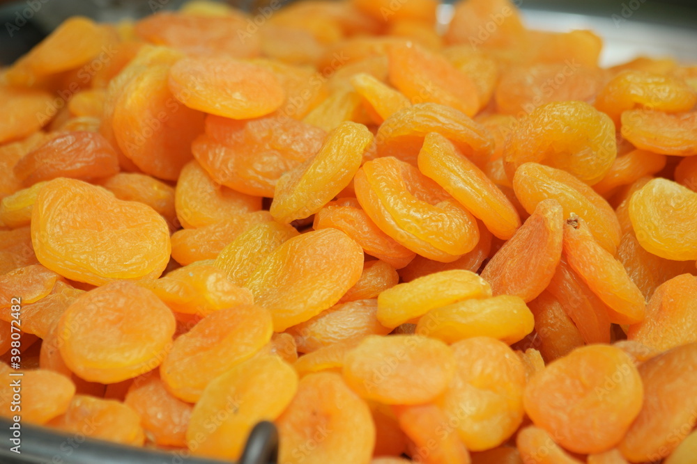 Heap of dried apricot fruits close up. Delicious dried apricots background. Healthy natural food. Heap of dried apricot fruits close up. Delicious dried apricots background. Healthy natural food.