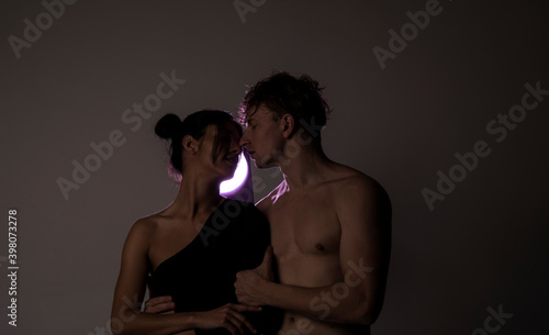Couple in love. Sensual. Portrait of happy loving couple. Man and woman. Lovely. Female. Light. Background. 