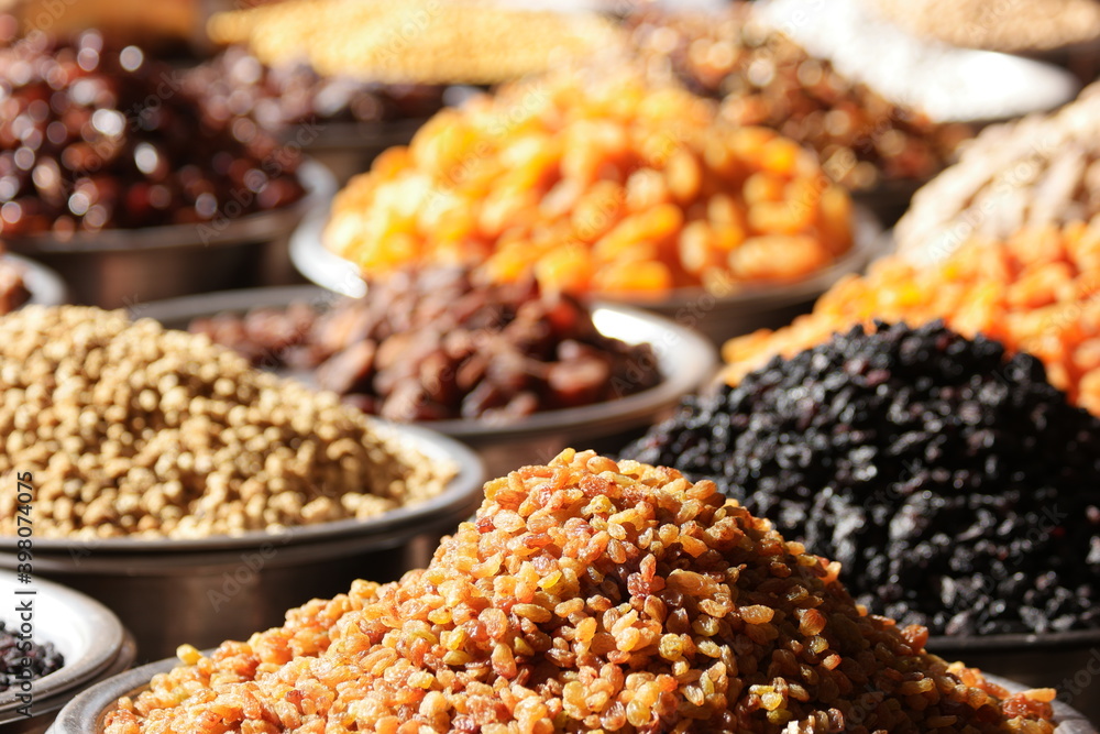 Various types of dried fruits at farmers market. Raisins and other dried fruits for sale at local city market.