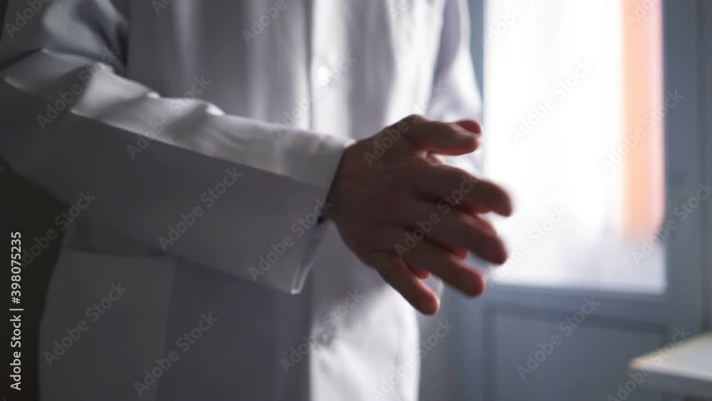Close Up of Medical Physician is Cleaning Hands with Liquid Hand Sanitizer Close Up of Medical Physician is Cleaning Hands with Liquid Hand Sanitizer