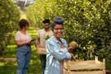 Portrait of smiling  African American woman in orchard
