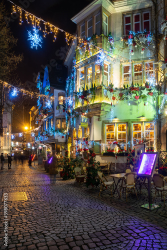 Evening street in Strassbourg, France, Christmas decoration and lights © catuncia