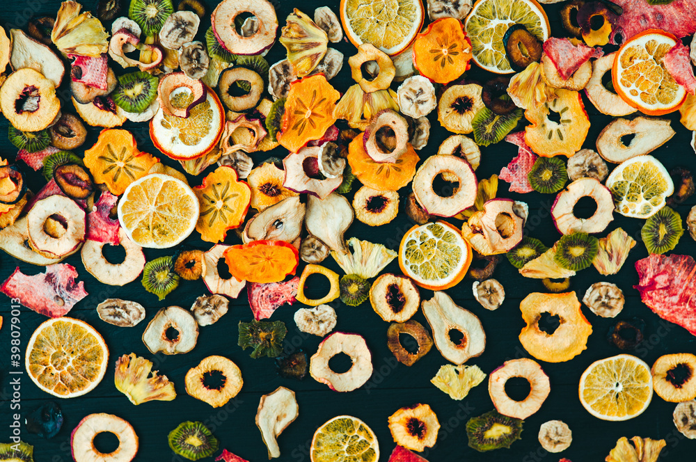 Organic Healthy Assorted Dried Fruit Mix close up. Dried fruit snacks. dried apples, mango, feijoa, dried apricots, prunes top view Organic Healthy Assorted Dried Fruit Mix close up. Dried fruit snacks. dried apples, mango, feijoa, dried apricots, prunes top view
