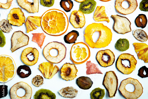 Organic Healthy Assorted Dried Fruit Mix close up. Dried fruit snacks. dried apples, mango, feijoa, dried apricots, prunes top view