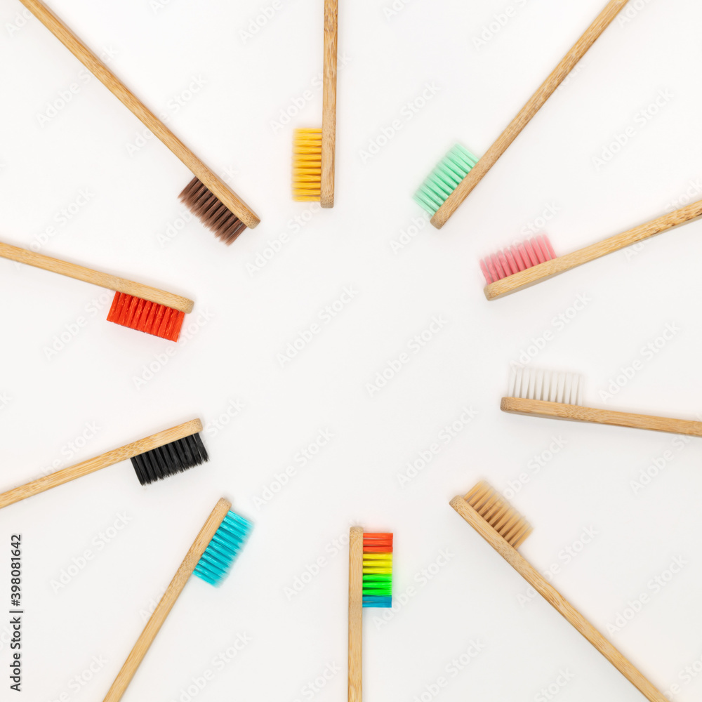 Multicolored bamboo toothbrushes on white background Multicolored bamboo toothbrushes on white background