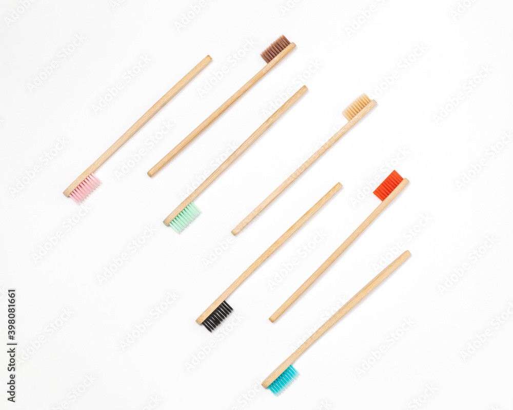 Multicolored bamboo toothbrushes on white background Multicolored bamboo toothbrushes on white background