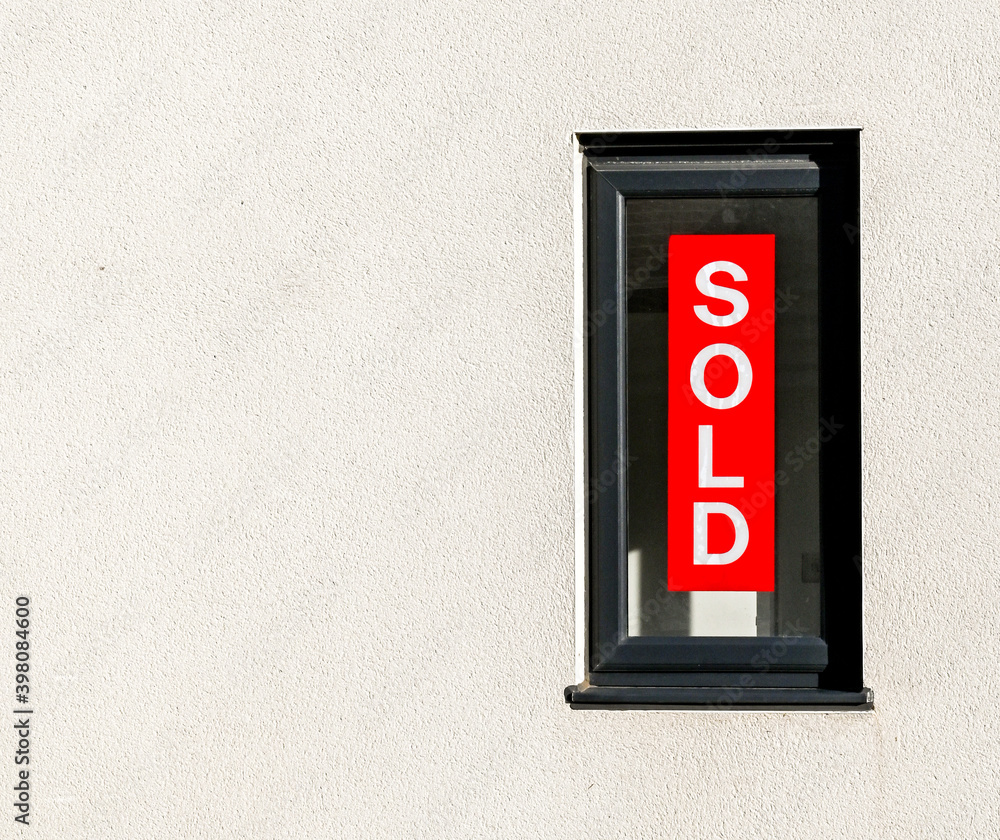 Sold sign in the window of a newly built house. No people. Copy space, Sold sign in the window of a newly built house. No people. Copy space,