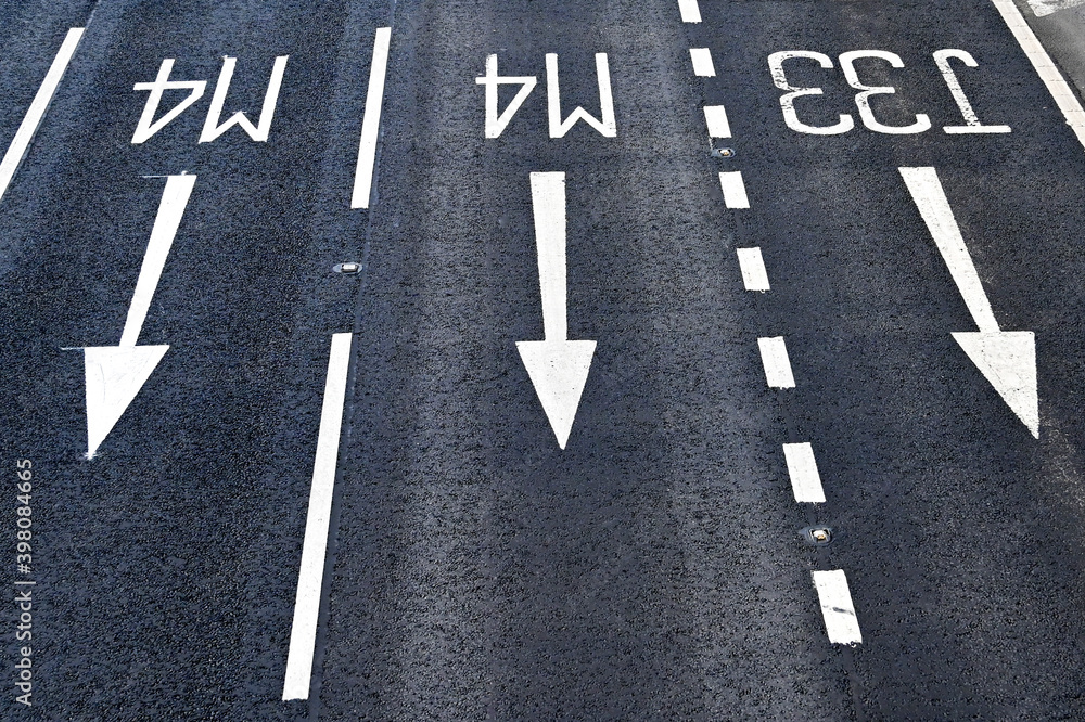Road markings approaching a junction on a motorway. No people.