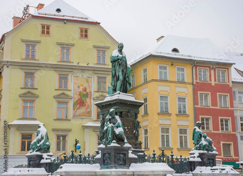 Main square Hauptplatz with Erzherzog Johann fountain and historical buildings in the background, in winter, in Graz, Styria region, Austria.