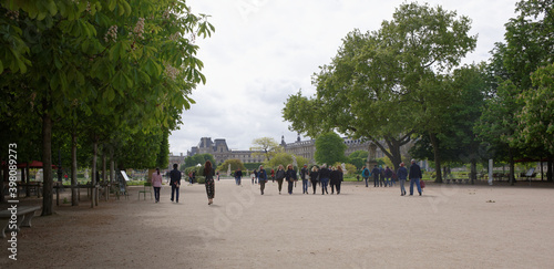  The garden of the Tuileries. Along the avenue Santral go people photo