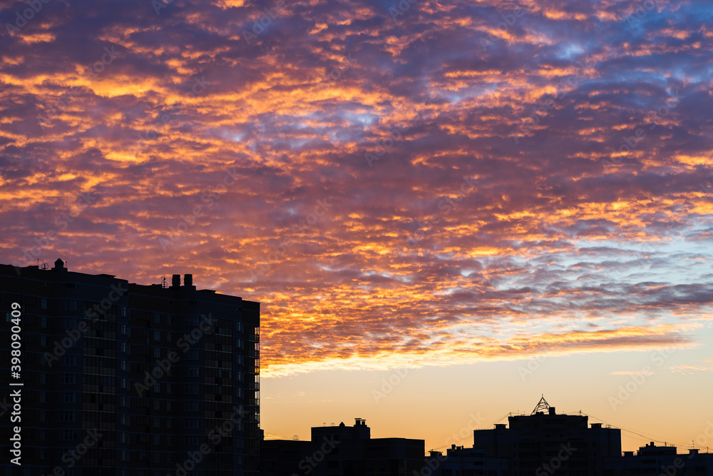 sky, colorful bright crimson dawn sunrise over the city, beautiful view of the dawn sky, orange yellow blue sky color