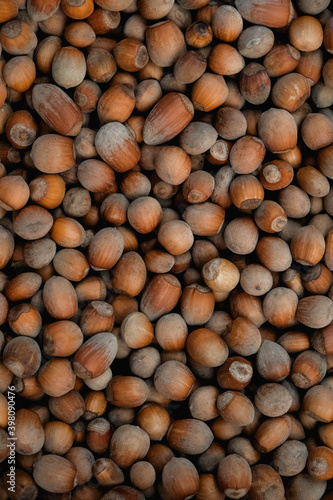 Hazelnuts as a background texture image. Top view. Copy  empty space for text