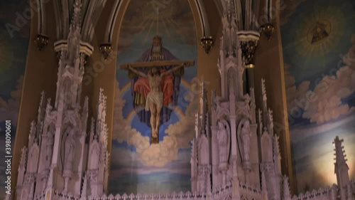 Interior of Saint Alphonsus Church, Chicago USA, Tilt Down From Ceiling to Altar Slow Motion photo