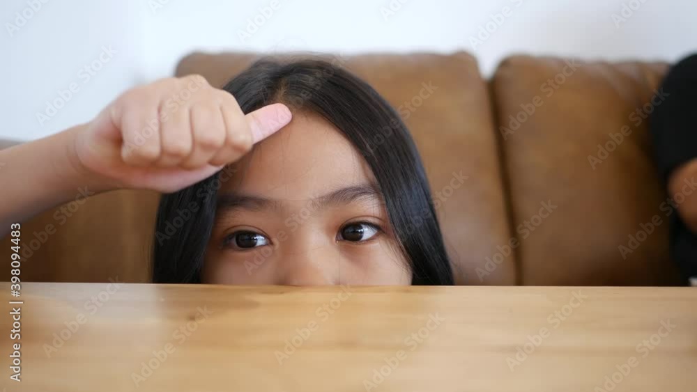 Asian children feel happy relaxing in the living room Asian children feel happy relaxing in the living room