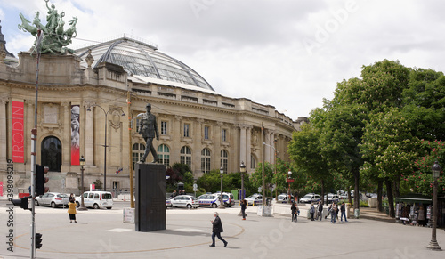 Monument to Charles de Gaulle on Place Clemenceau. Citizens walk and take pictures photo