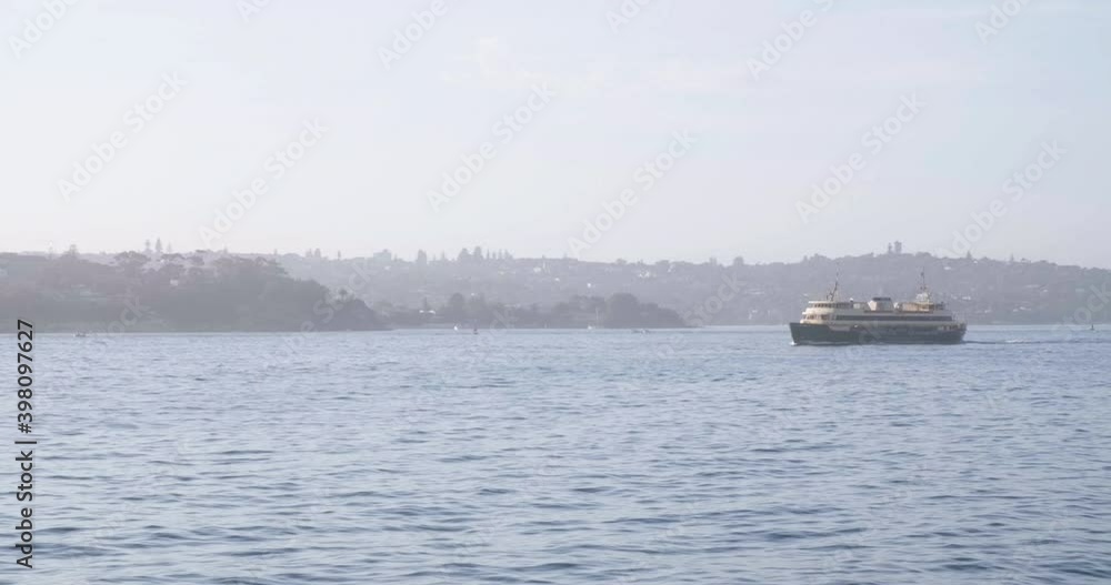 Cruise Ship Sailing Across Sydney Harbour At Daytime In Sydney, NSW, Australia. - wide shot Cruise Ship Sailing Across Sydney Harbour At Daytime In Sydney, NSW, Australia. - wide shot