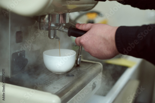 Brewing espresso in a steam coffee machine