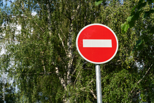 road sign brick against trees as a symbol of new restrictions due to coronavirus