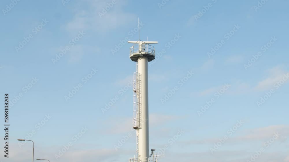 Nautical radar spinning on top of tower - wide Nautical radar spinning on top of tower - wide