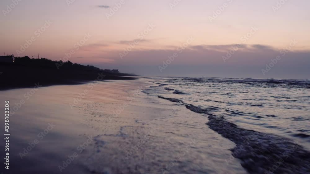 beach sunrise with waves rolling aerial flight extremely low and fast beach sunrise with waves rolling aerial flight extremely low and fast