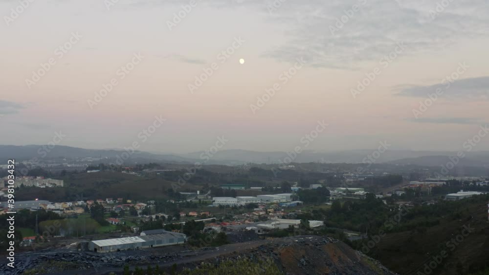 Foggy Landscape In Portugal With Moon In The Sky At Sunset - aerial drone Foggy Landscape In Portugal With Moon In The Sky At Sunset - aerial drone