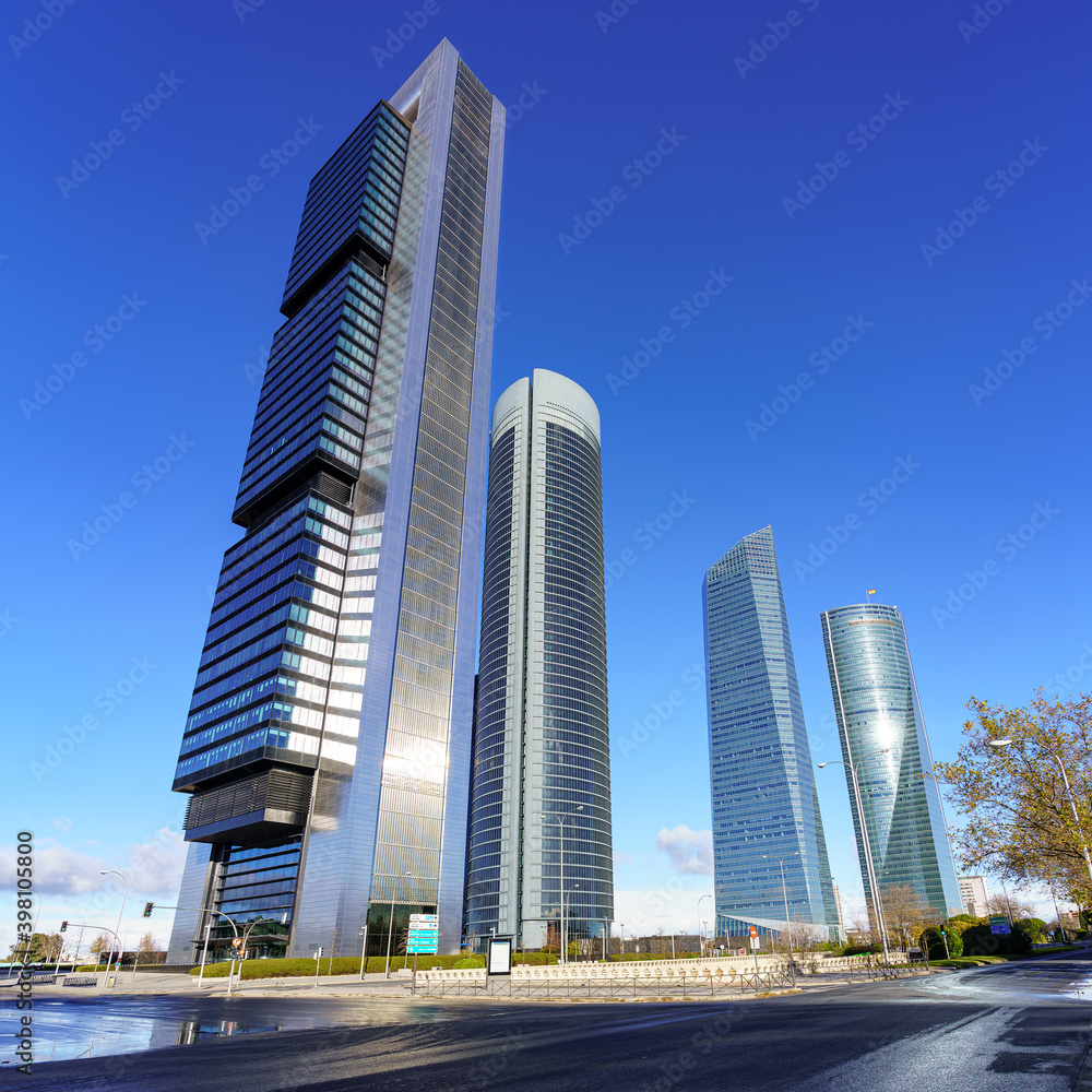 Madrid Skyline with office and business towers and skyscrapers on sunny day, blue sky and no people or cars.

