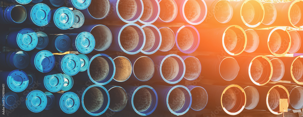 Plastic pipe background, big PVC pipes in stack for water and drain or wastewater. Plastic pipe background, big PVC pipes in stack for water and drain or wastewater.