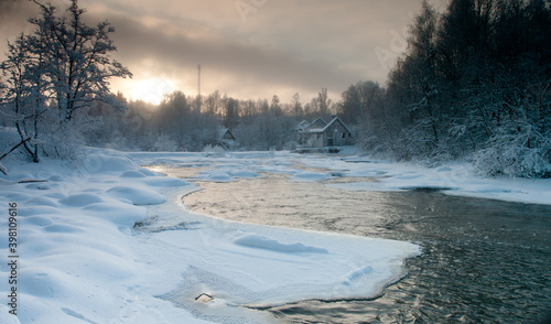 Beatifull river with snow covered banks on sunset © Timo