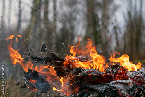 Pile of burning cardboard and waste paper