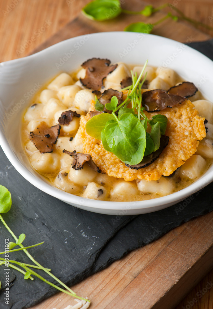 Gnocchi. Pasta sautéed with truffles garlic, onions, olive oil and fresh herbs and spices. Classic American steakhouse or French bistro appetizer or side dish. Gnocchi. Pasta sautéed with truffles garlic, onions, olive oil and fresh herbs and spices. Classic American steakhouse or French bistro appetizer or side dish.