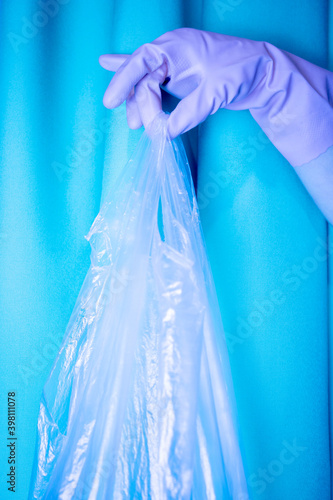 hand with blue bag