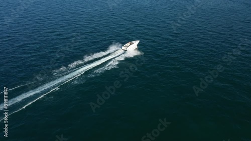 Wallpaper Mural Large white boat fast movement on dark blue water to meet the sun at sunset, side view of the boat 4k video Torontodigital.ca