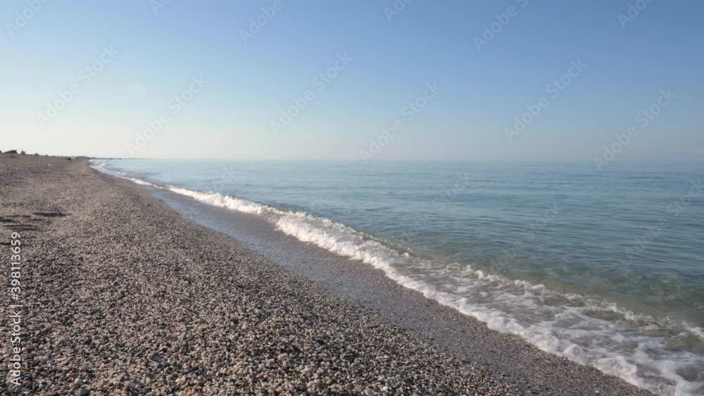 Morning calm sea with small waves and cold lighting. Ocean morning or twilight. Morning calm sea with small waves and cold lighting. Ocean morning or twilight.