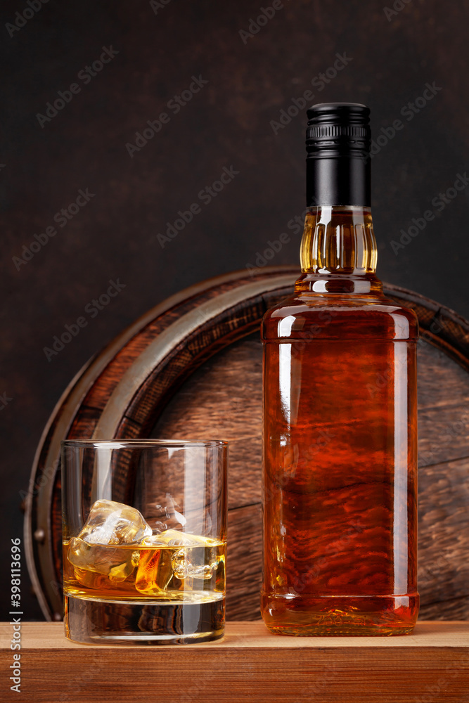 Scotch whiskey bottle, glass and old barrel Scotch whiskey bottle, glass and old barrel