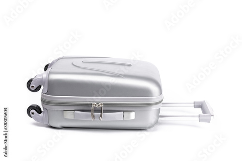 Travel suitcase isolated. Silver plastic luggage or vacation baggage bag on white background. Design of summer vacation holiday concept.