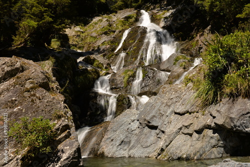 Fototapeta Naklejka Na Ścianę i Meble -  Waterfall at Haast Pass at Mount Aspiring National Park