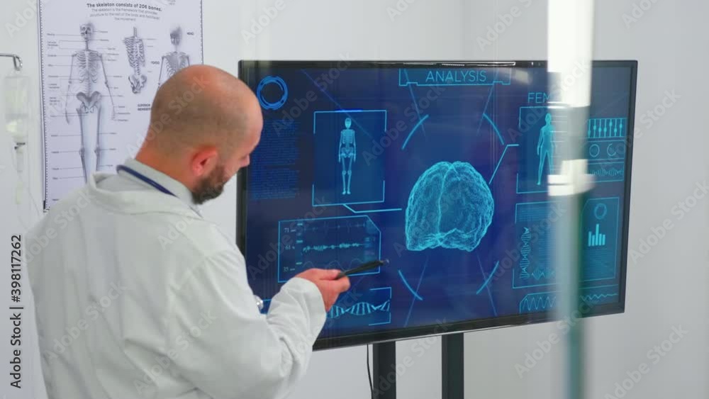 Medical people holding meeting in boardroom with neurologist doctor analysing brain activity using digital monitor. Team of doctors discussing diagnosis about patients treatment issues Medical people holding meeting in boardroom with neurologist doctor analysing brain activity using digital monitor. Team of doctors discussing diagnosis about patients treatment issues