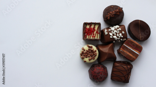 Assortment of chocolates. The concept of the holiday and tasty food. Sweet dessert. Delicious gift in a box Holiday concept. Selective focus