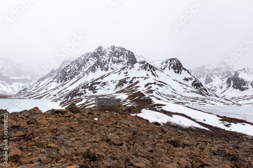 Wooden shelter on mountain ridge in Chugach State Park, Alaska