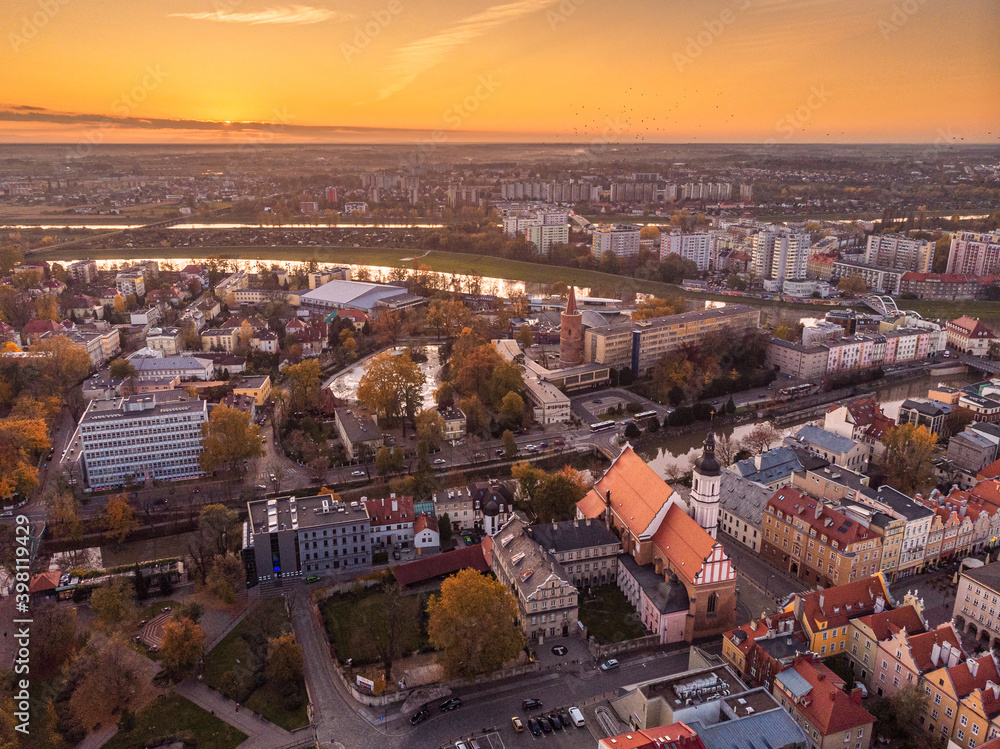 Fototapeta premium A drone view of the historic city with the market square, churches and the town hall in Opole during sunset. Autumn in Silesia - Poland.