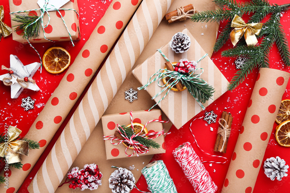 Fototapeta premium Gift boxes with ornaments on red background