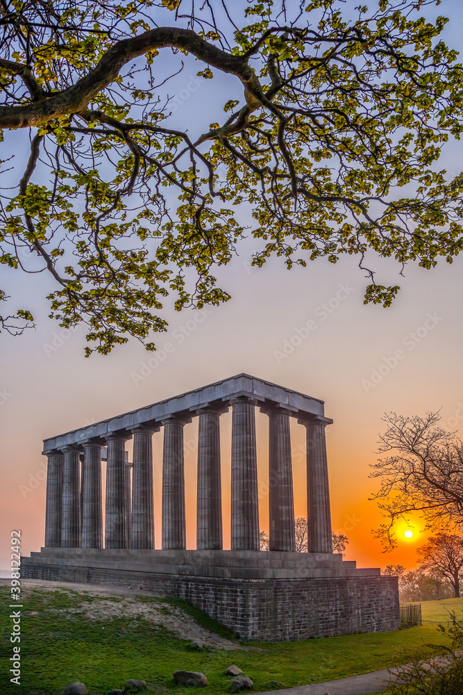 Obraz premium View of National Monument of Scotland against sunset on Calton Hill in Edinburgh, Scotland